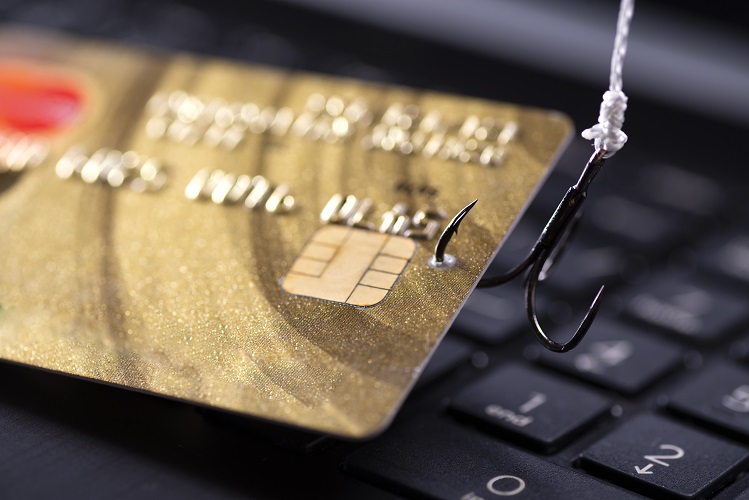 internet-fraud-using-computer-technology-stealing-money-internet-stealing-credit-card-data-hook-hooked-credit-card-laptop-keyboard-background